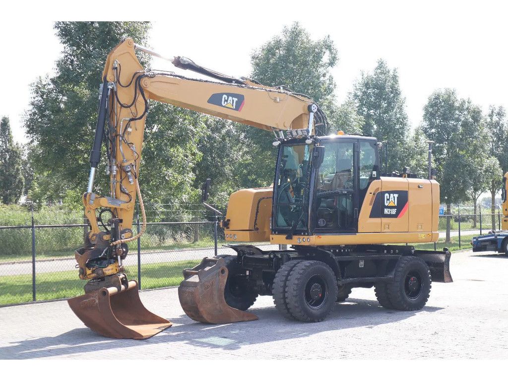 Caterpillar-M318F-2015-01 Pelle sur pneus Caterpillar M318F 2015 – 17,9T – 12013h – Occasion – Image 1